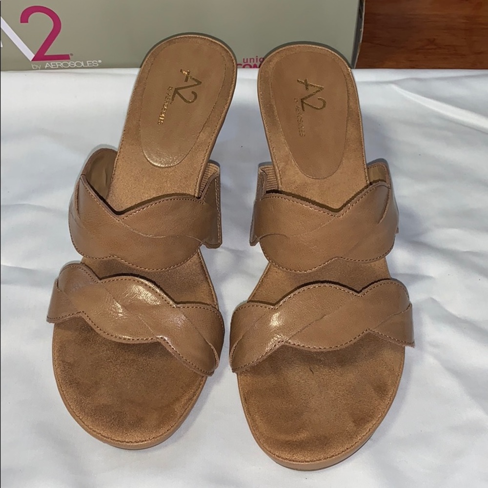 Twisted strap slip on sandals